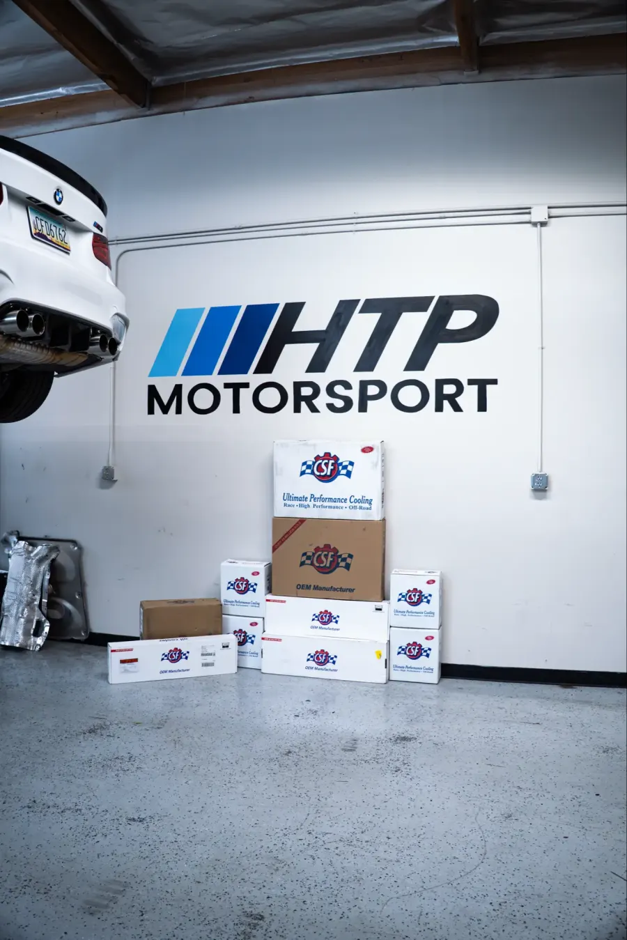 HTP Motorsport logo on the shop wall